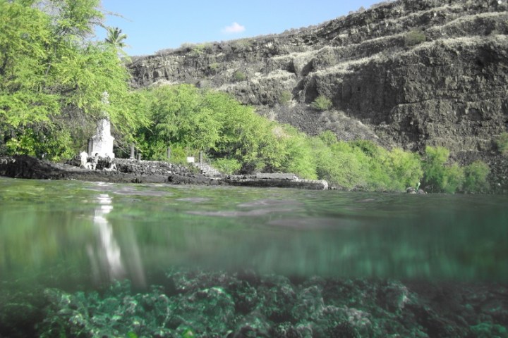a large waterfall over a body of water